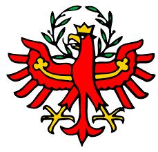 Wappen eines roten Adlers mit goldener Krone und Lorbeerkranz.